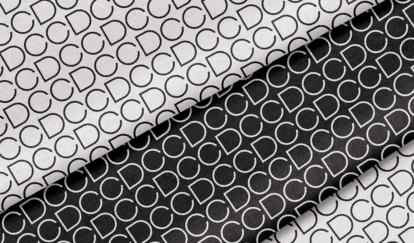 Cdc Designs Repeating Logo Pattern on fabric