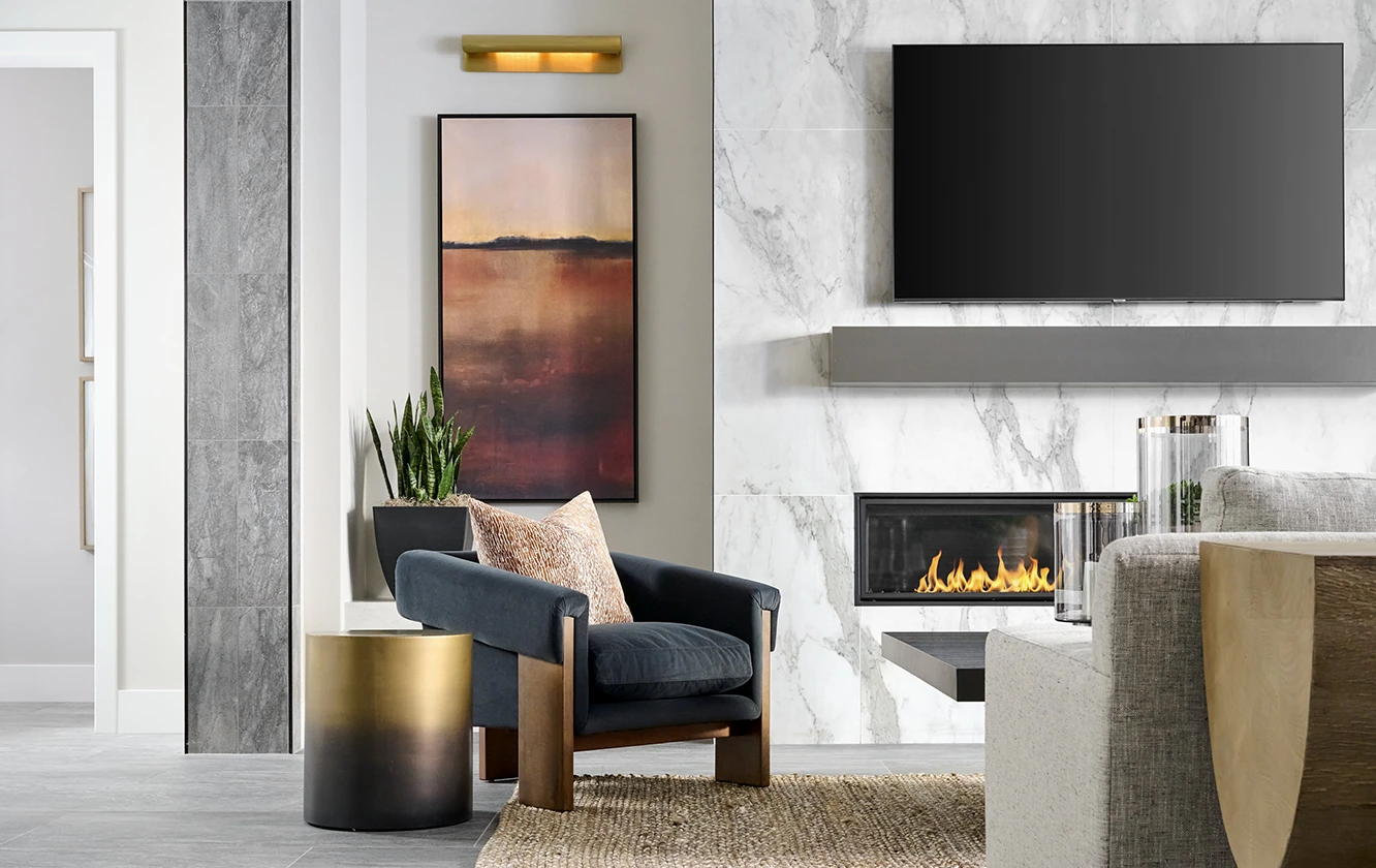 CDC Home Interior Design. Luxurious living room with fireplace going.
